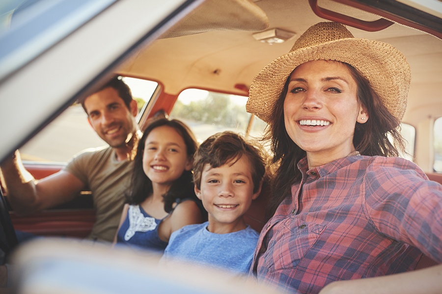 Personal Insurance. - Portrait Of Family Relaxing in the Car During a Road Trip
